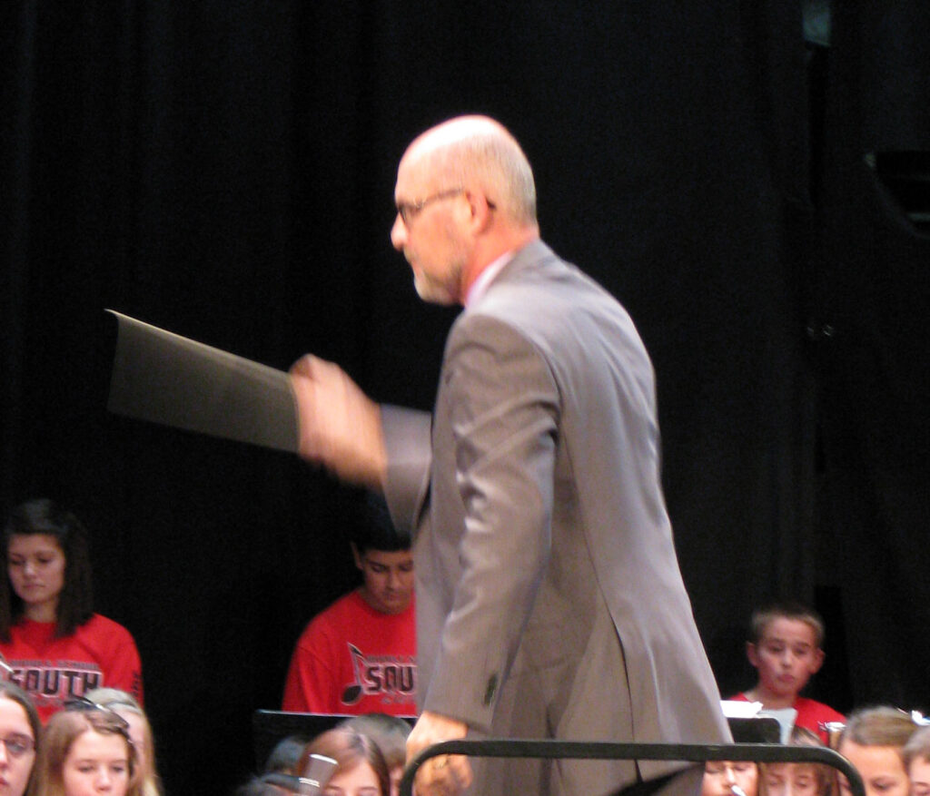 Photo of Bill Simon conducting